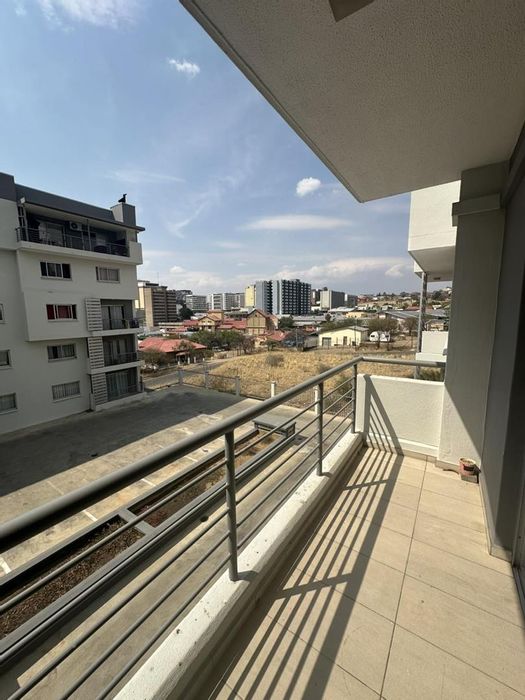 For Sale: Apartment in Windhoek Central with balcony, parking, and city views.