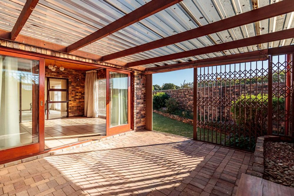 Patio with clear roofing and security sliding door
