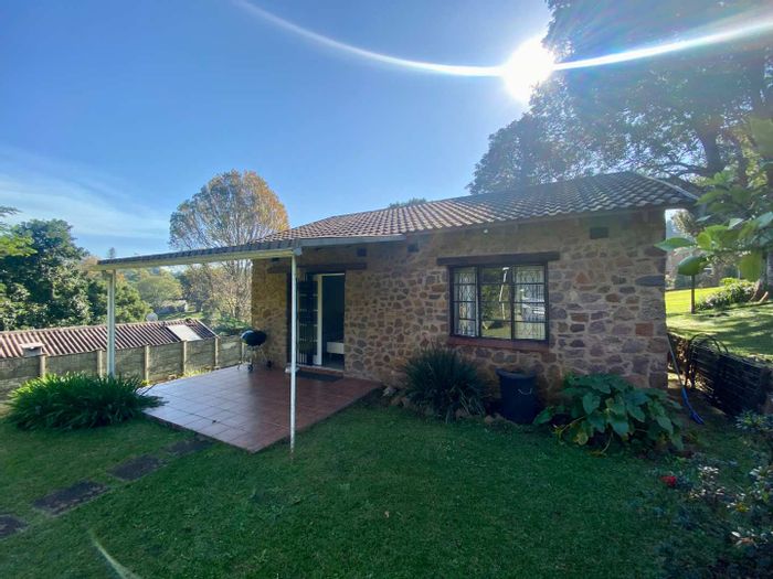 Charming Hillcrest Park house to rent, pet-friendly yard, covered patio, and carport.
