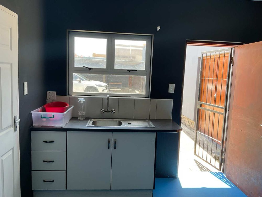 VIEW OF KITCHENETTE IN 8 X BACHELOR FLATS