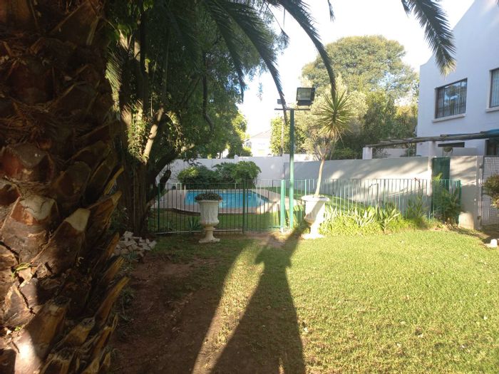 Pet-Friendly Apartment To Rent in Sandton Central with secure parking and yard.