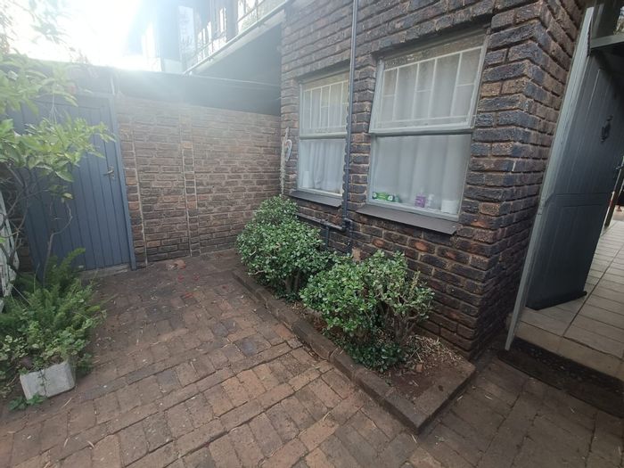 For Sale: Clubview Townhouse with private garden, garage, and versatile living spaces.