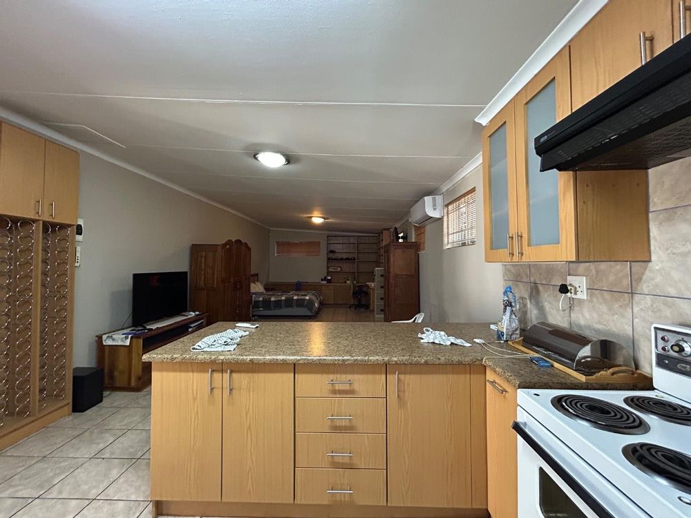 Bachelor flat kitchen and bedroom.