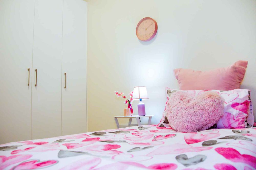 Third bedroom with built-in cupboards.