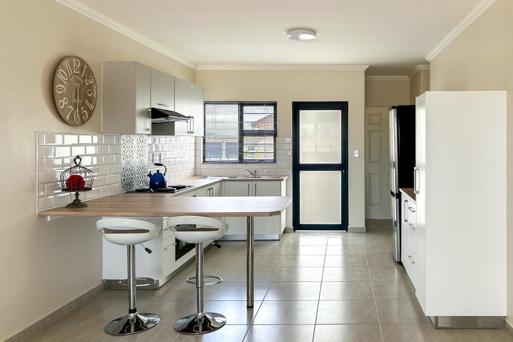 Kitchen with plenty of built-in cupboards and a built-in oven.