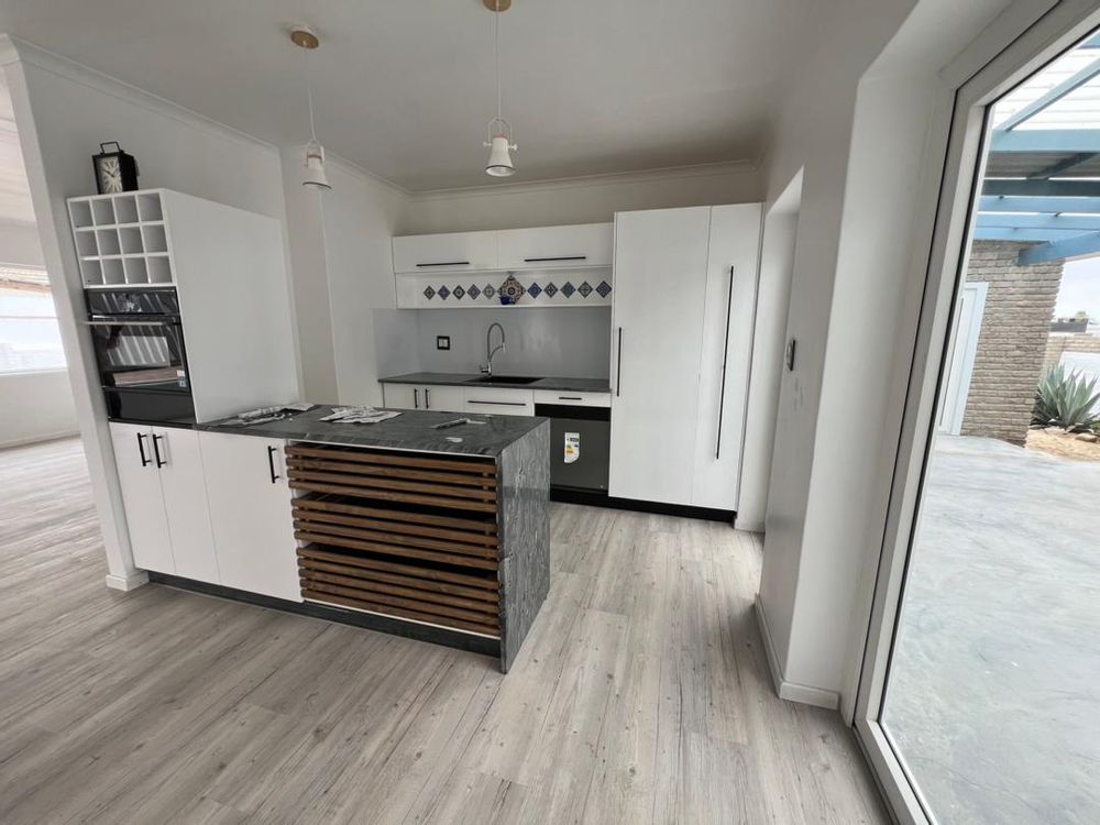 Kitchen and doors leading to patio