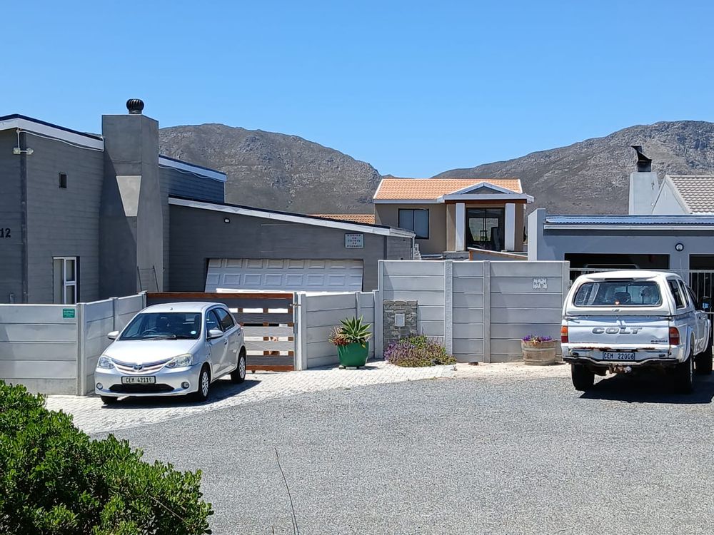 House across the Street; Mountain at the back.