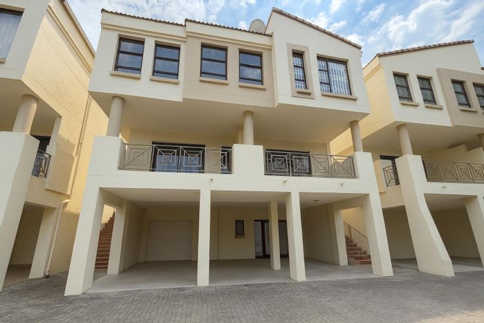 For Sale: 3-Bedroom Townhouse in Kilberry with pool, garage, and rental income.