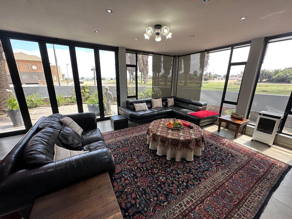 Entertainment area with inside barbeque, with park and sea views.