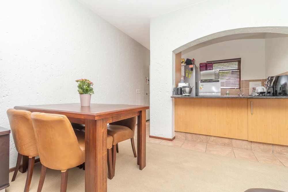 Living area dining towards kitchen