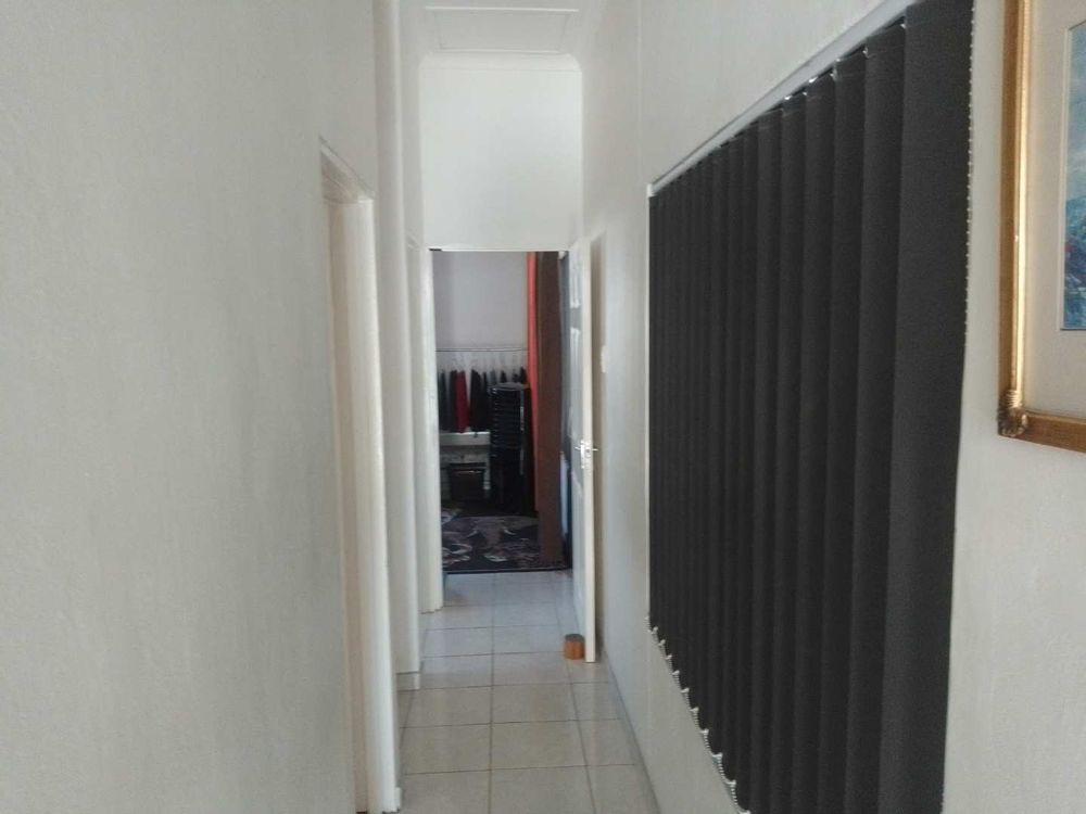 General view of the passage towards the second bedroom. Note all blinds forms part of the sale. 