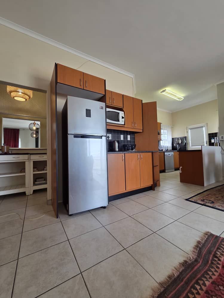 Open plan kitchen leading to hallway
