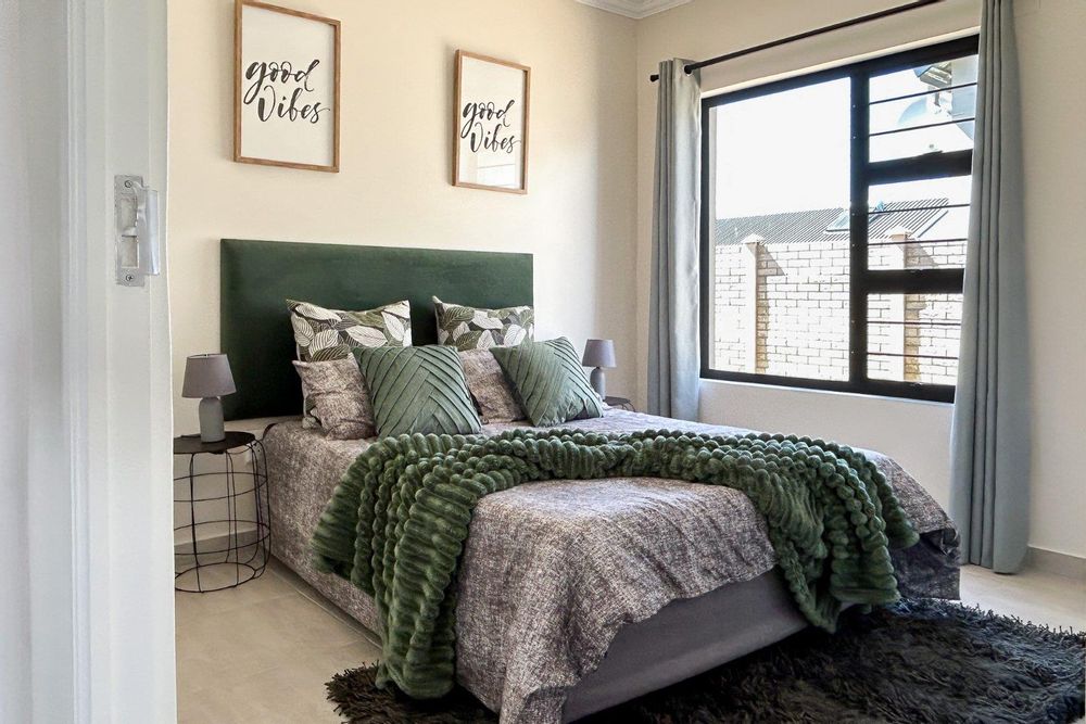 Third bedroom with built-in cupboards.