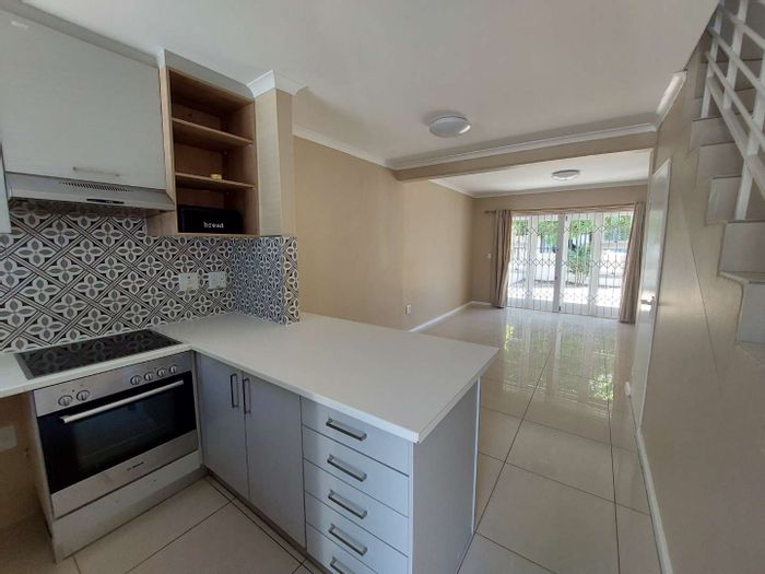 2-Bedroom Apartment To Rent in Rondebosch East with pool, patio, and secure parking.