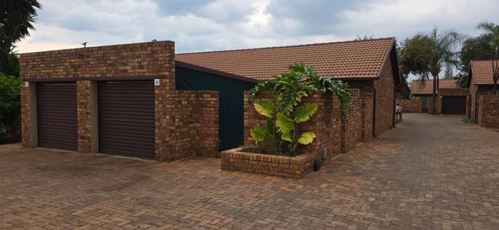 Terenure Townhouse For Sale: Two bedrooms, private garden, garage, and security features.