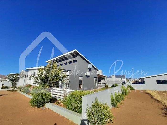For Sale: House in Finkenstein with open-plan living, garden, and security features.