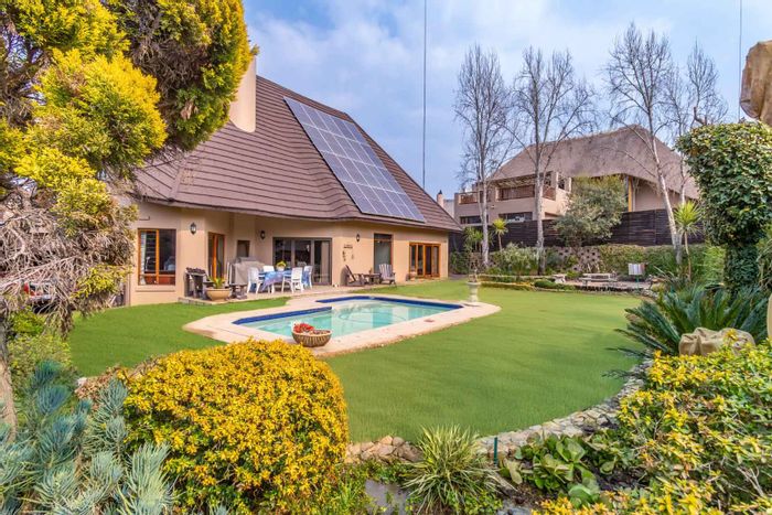 Kyalami House For Sale: Spacious garden, pool, en-suite bedrooms, and ample parking.