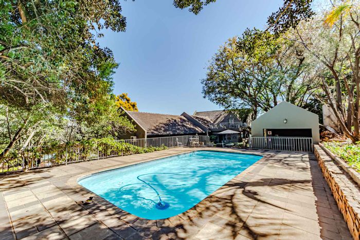 For Sale: House in Waterkloof Ridge with 11 guest rooms, pool, and gardens.