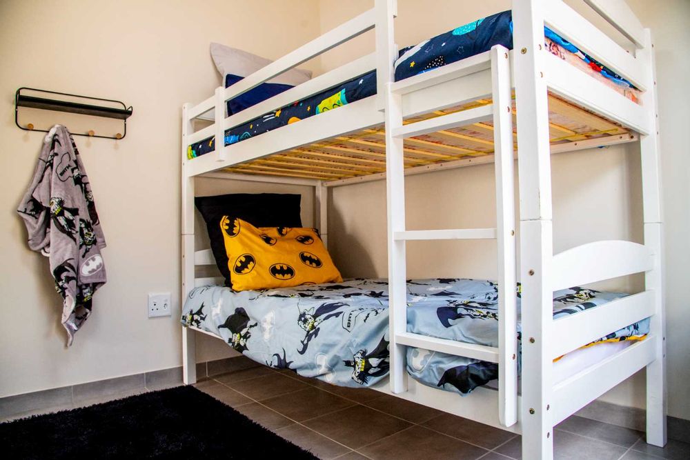 Second bedroom with built-in cupboards.