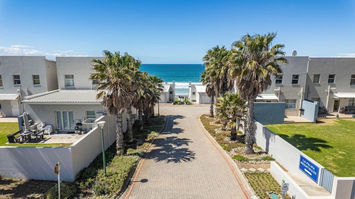 Beachfront apartment for sale in Diaz Beach with secure access and rental potential.