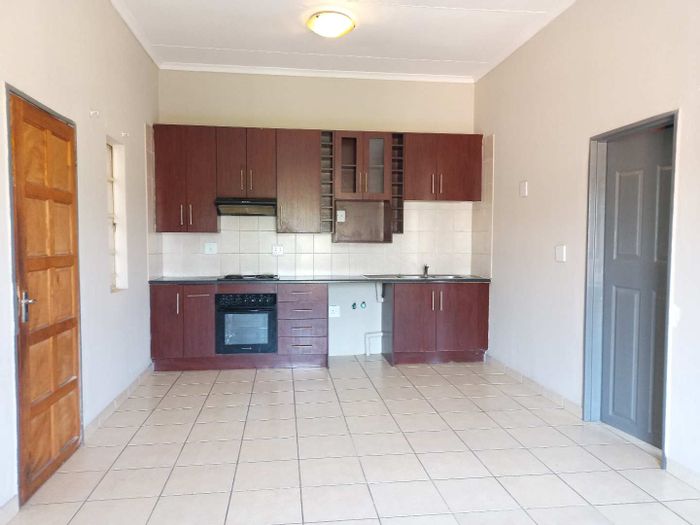 1-Bedroom Townhouse For Sale in Norkem Park with security, pool, and clubhouse.