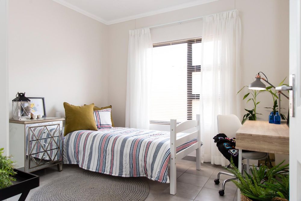 Third bedroom with built-in cupboards.