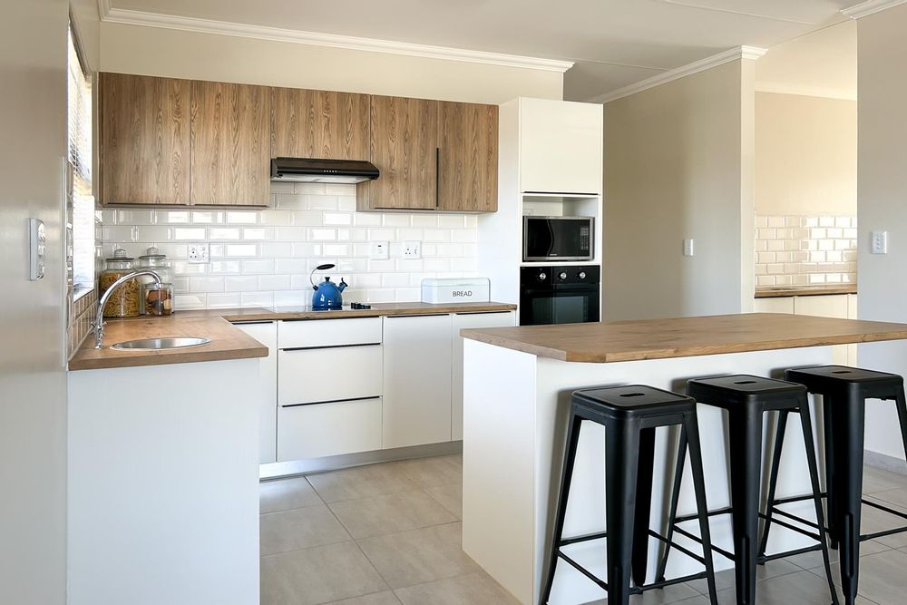 Modern kitchen island with scullery.