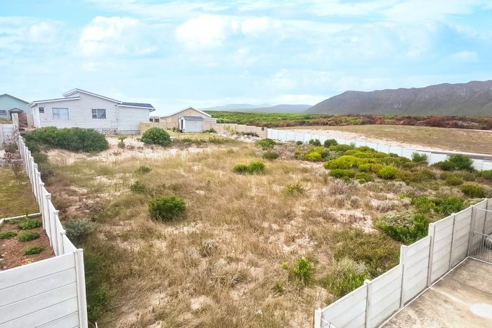 Vacant Land Residential for Sale in Perlemoenbaai with mountain views and beach access.