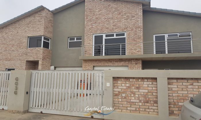 House for Sale in Swakopmund Ext 19: Two residences, balconies, indoor BBQ, tandem garages.
