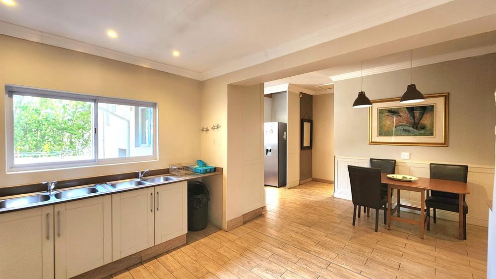 View towards 2nd set of wash up and prep basins and kitchen dining space.