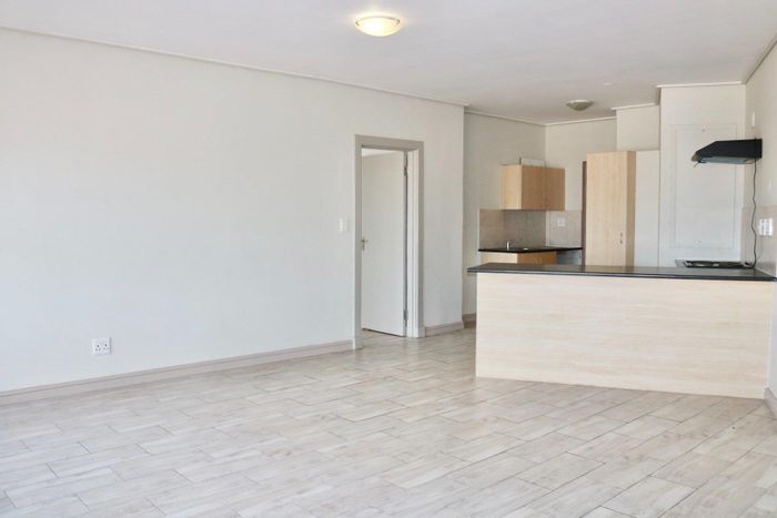 Milnerton Central Apartment For Sale: Stunning Views, Open-Plan Living, Prime Amenities!