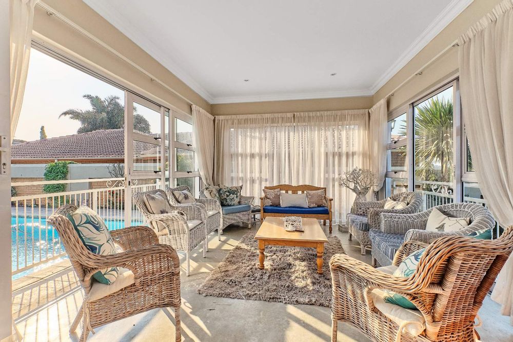 Sun room with sliding doors to the pool