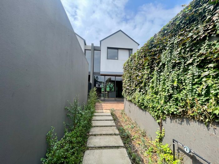 For Sale: Townhouse in Sheffield Beach Central with clubhouse, pools, and gardens.