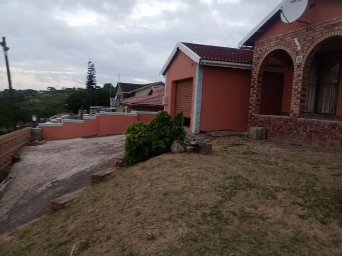 4-bedroom house in Umlazi Bb for sale, features garage, verandah, and security.