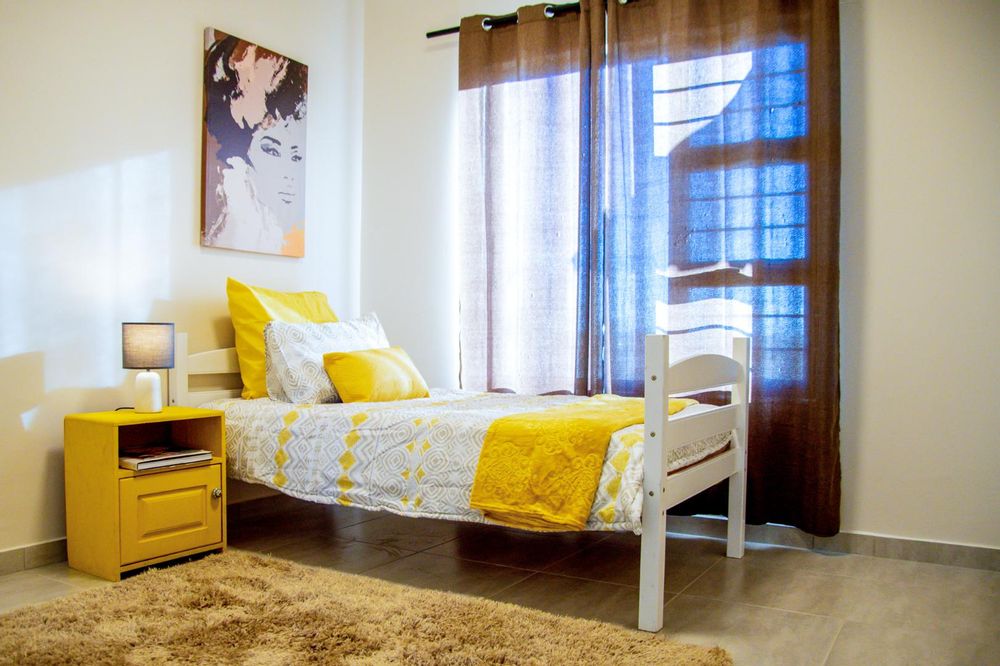 Second bedroom with built-in cupboards.