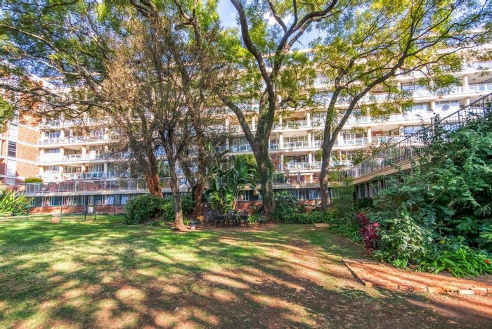 For Sale: Spacious Riviera apartment with pool views, three bedrooms, and parking.