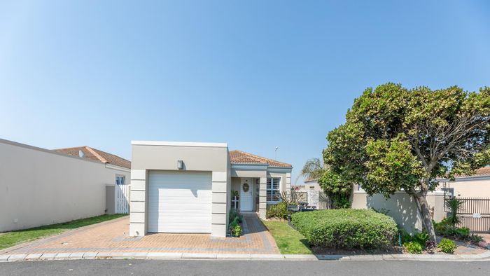 For Sale: House in Melkbosstrand Central with secure complex, garden, and rental income.