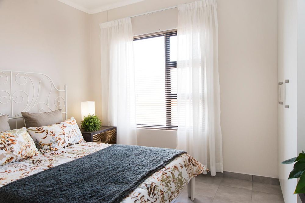 Fourth bedroom with built-in cupboards.