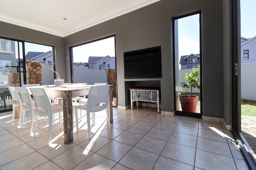 Patio with built-in braai as seen from lounge