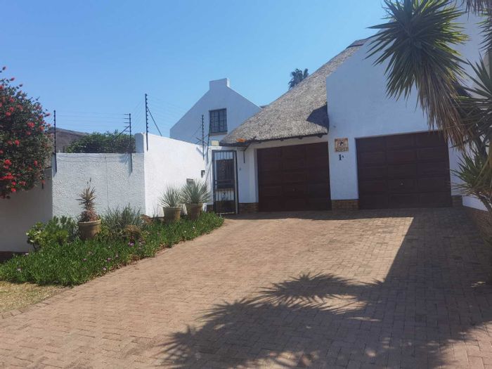 For Sale: House in Van Riebeeck Park with pool, garden, and spacious living areas.