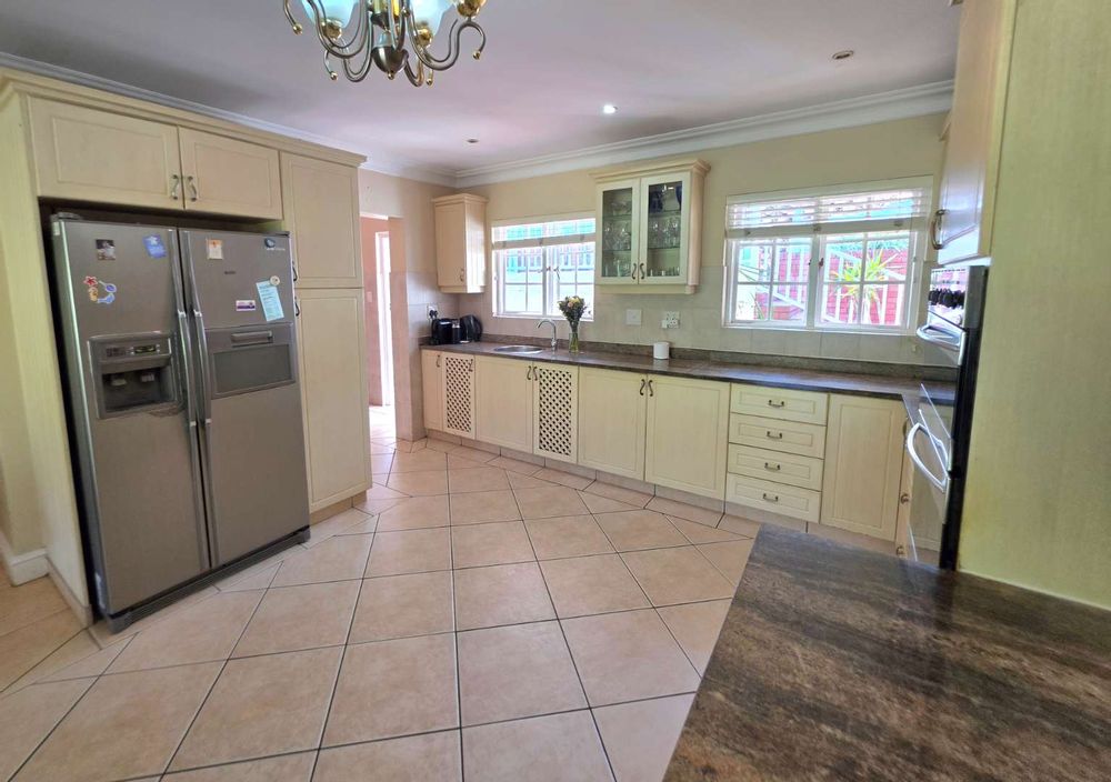 Kitchen leading into scullery plumbed for dishwasher and washing machine 