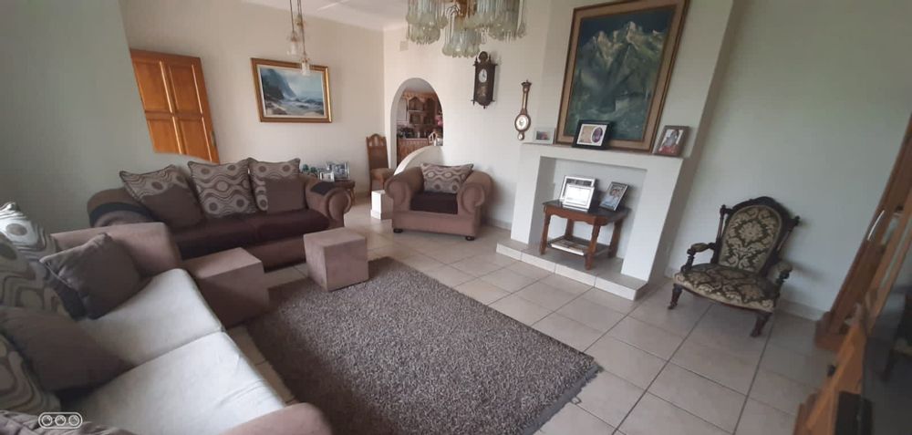 Large fully tiled lounge with a fireplace facility and plenty place to be cozy with the family
