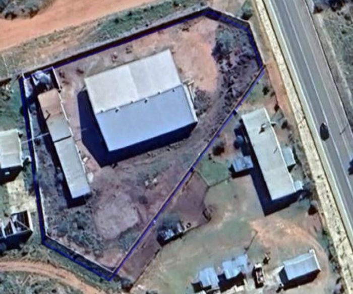 Industrial property for sale in Dysselsdorp with large buildings and boiler equipment.