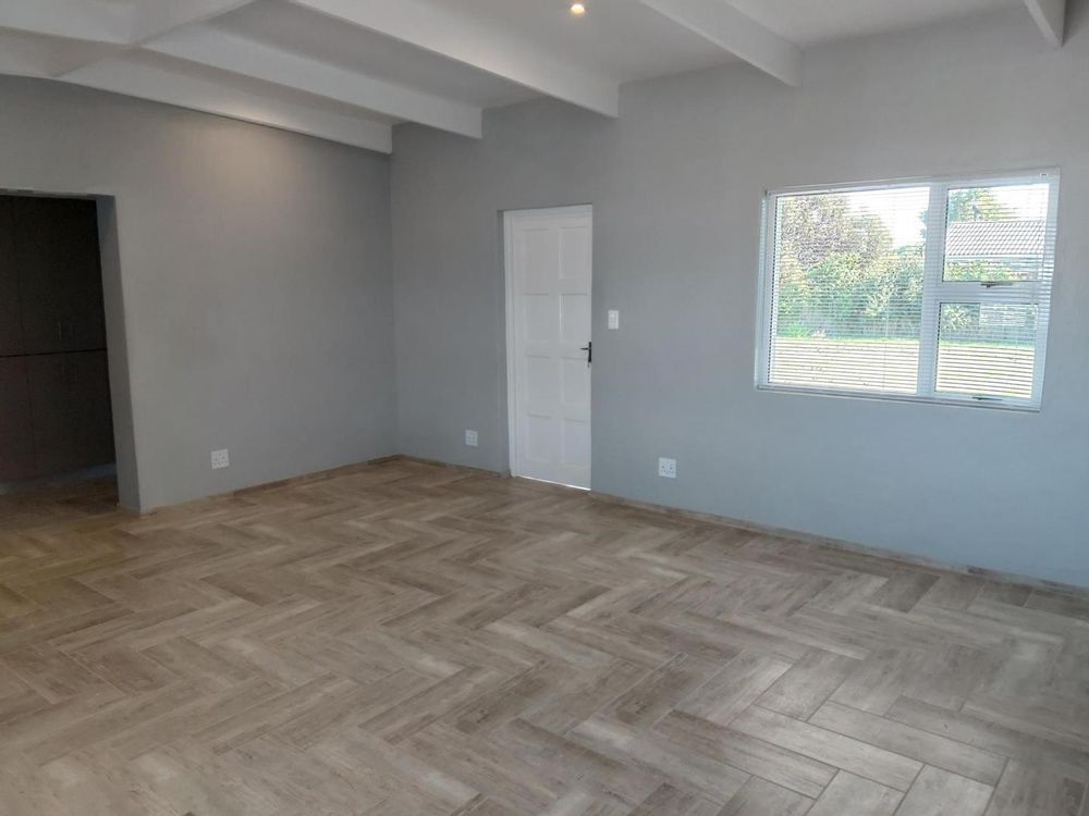 Backdoor to patio and braai area