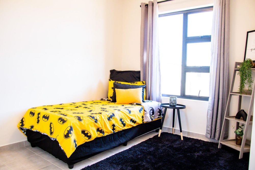 Second bedroom with built-in cupboards.