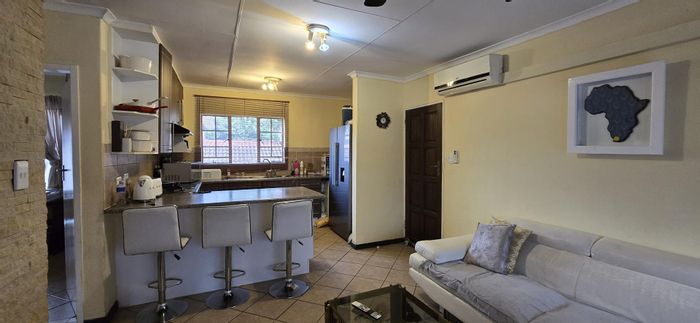 For Sale: Apartment in Mooikloof Ridge with pool, tennis court, and security.