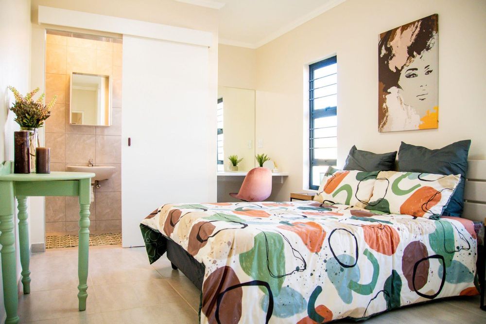 Main bedroom with built-in cupboards & ensuite.