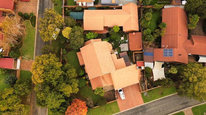 For Sale: House in Sunward Park with dual homes, garages, and private garden.
