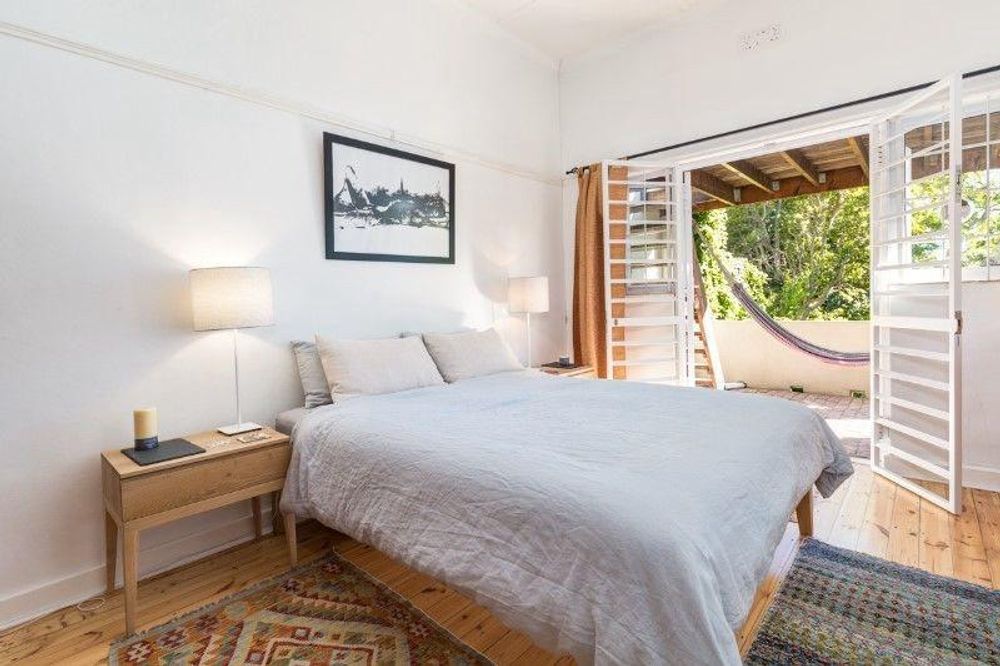 Main bedroom with glass doors leading out to patio