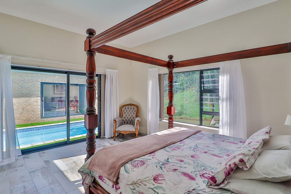 Main Bedroom, En-suite Bathroom and view of pool